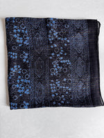 Charcoal cotton square scarf woven with sparkly lurex threads and a blue printed pattern