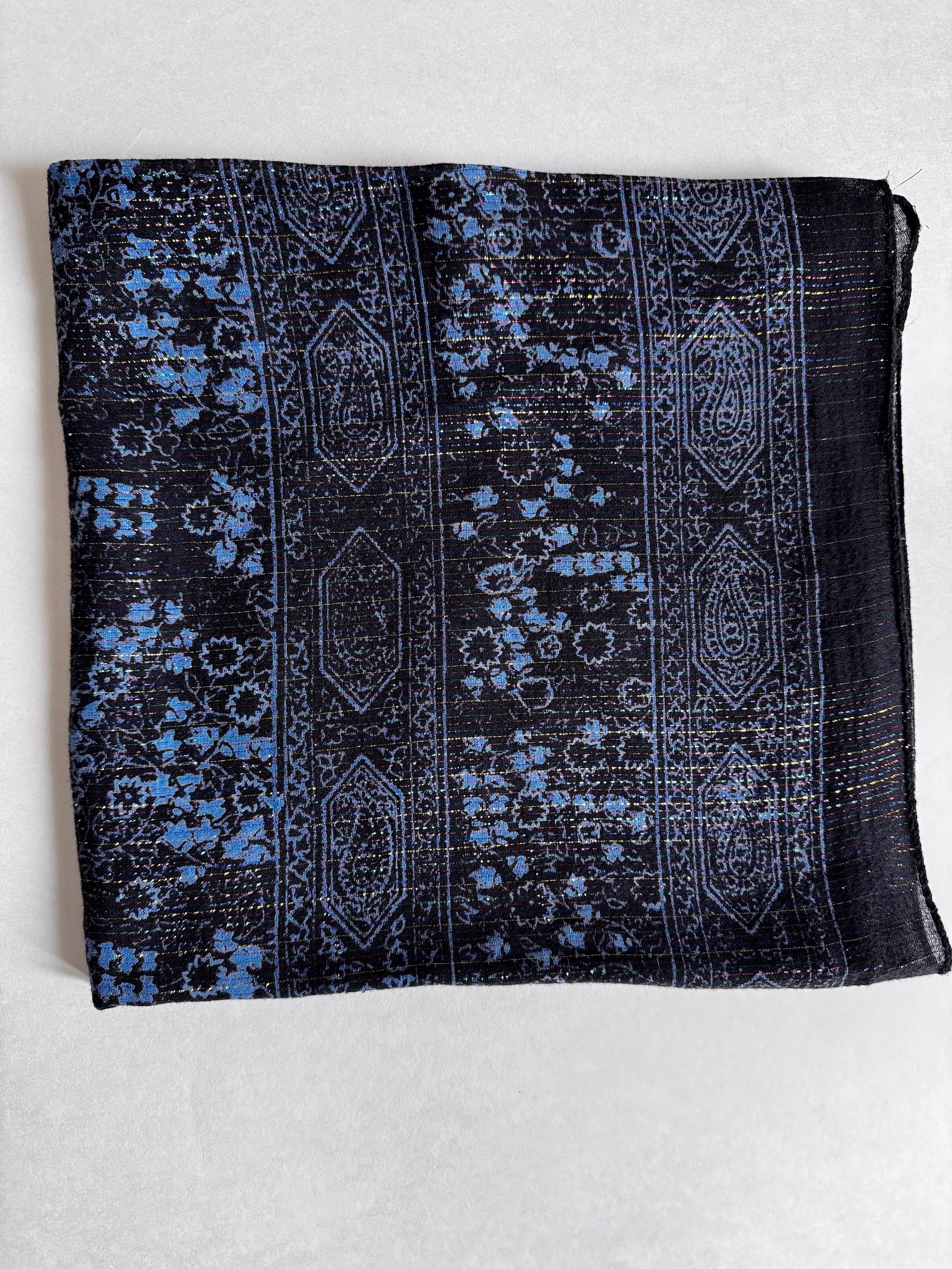 Charcoal cotton square scarf woven with sparkly lurex threads and a blue printed pattern