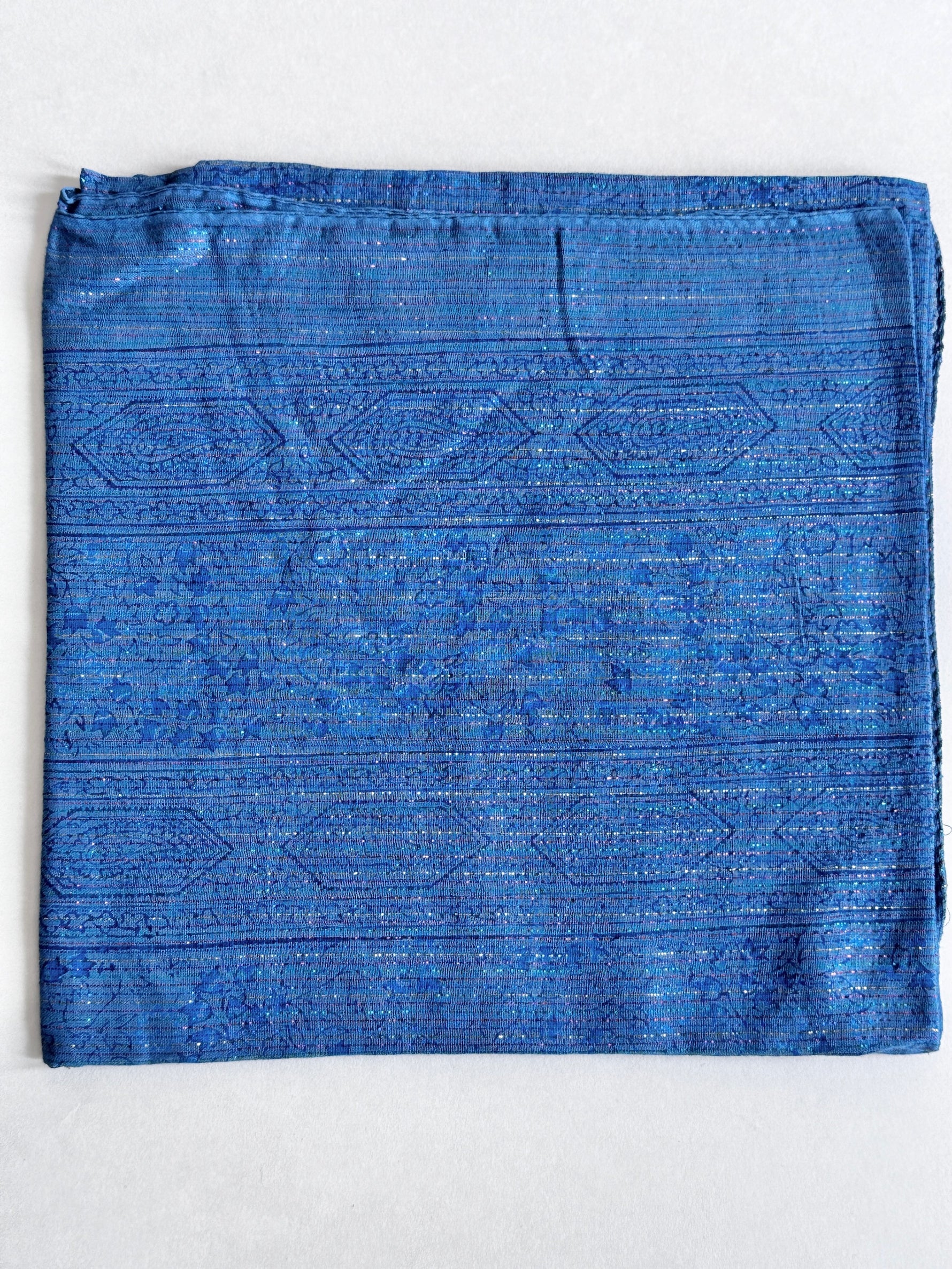Blue cotton square scarf woven with sparkly lurex threads and a d.blue printed pattern

