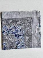 Ivory cotton square scarf woven with sparkly lurex threads and a blue printed pattern